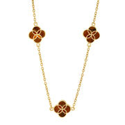 18K gold vermeil tiger eye petal Seed of Life three-station necklace full view showing three natural chatoyant tiger eye quatrefoil clover stations with Seed of Life gold cutwork lattice on medium gold cable chain by Jan Leslie