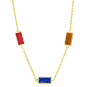 Gold cable chain station necklace with three mixed rectangular gemstone pendants in red carnelian, tiger's eye, and lapis lazuli gold bezel settings.