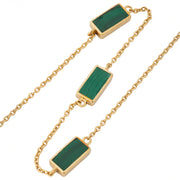 Angled close-up of gold vermeil sterling silver three-station malachite rectangle necklace showing bezel-set banded green stone inlay detail and oval link cable chain, Jan Leslie luxury women's fine jewelry detail.