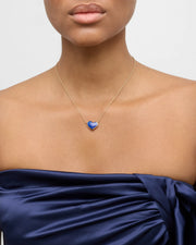 Model wearing gold vermeil lapis lazuli heart pendant necklace on delicate cable chain with navy strapless gown by Jan Leslie.