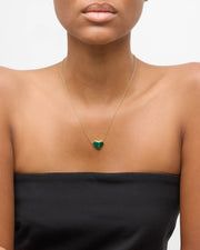  Model wearing gold vermeil malachite heart pendant necklace on delicate cable chain with black strapless top by Jan Leslie.