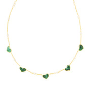 Gold vermeil sterling silver station necklace with five malachite heart charms and freshwater pearl accents on delicate cable chain, Jan Leslie luxury women's fine jewelry.