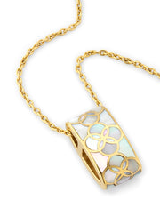 18K gold vermeil white mother-of-pearl petal Seed of Life barrel pendant necklace angled view showing luminous white iridescent MOP ground raised gold Seed of Life cutwork lattice and integrated chain-through-bail construction by Jan Leslie