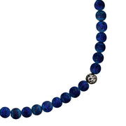Close-up of polished sterling silver toggle bar and ring clasp on matte lapis lazuli round bead necklace, Jan Leslie 