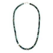 Close-up detail of matte lapis lazuli round bead necklace showing deep blue stone texture and oxidized sterling silver filigree accent bead, Jan Leslie 