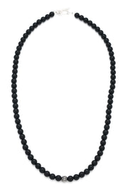 Full strand of matte black onyx round bead necklace with uniform deep black stones, oxidized sterling silver filigree accent bead, and polished sterling silver lobster clasp, Jan Leslie