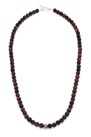 Full strand of matte red tiger's eye round bead necklace with deep burgundy and black banding, oxidized sterling silver filigree accent bead, and sterling silver toggle clasp, Jan Leslie luxury men's gemstone bead necklace
