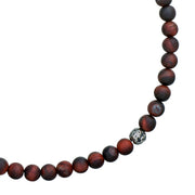 Close-up detail of matte red tiger's eye round bead necklace showing deep burgundy stone texture and oxidized sterling silver filigree accent bead, Jan Leslie luxury men's gemstone bead necklace