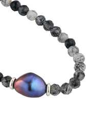  Black tourmalinated quartz bracelet close-up showing iridescent baroque peacock pearl centerpiece and sterling silver rondelle spacer detail by Jan Leslie.