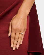 Woman's hand wearing gold vermeil sterling silver white mother of pearl floral lattice quatrefoil ring  Jan Leslie