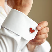 Red enamel heart sterling silver cufflink worn on white French cuff