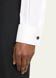 Man in white French-cuff dress shirt wearing black onyx and CZ round sterling silver cufflink — Jan Leslie
