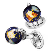 Pair staggered on white background showing oval swivel back closure: "Staggered pair of sterling silver spinning globe cufflinks with navy blue enamel ocean, multicolor enamel continents, gold latitude longitude line overlay, knurled silver equator band, and silver oval swivel back closure, Jan Leslie