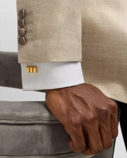 24k gold vermeil sterling silver gold bar cufflinks worn on white dress shirt cuff with beige suit