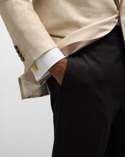 24k gold vermeil sterling silver gold bar cufflinks worn on white dress shirt cuff with beige suit and black trousers