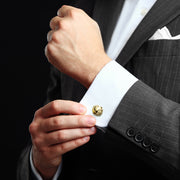 Gold vermeil classic knot cufflink being fastened on white French cuff