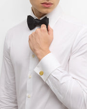 Men's gold ancient coin cufflinks styled on white tuxedo shirt with black bow tie, Jan Leslie