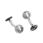 Side view of sterling silver 3D gear shift knob cufflinks on curved post with engraved 6-speed pattern and gunmetal steering wheel back closure.