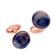 18K rose gold vermeil round pietersite cabochon cufflinks pair face-on view showing deep midnight blue pietersite with golden-brown chatoyant tiger's eye inclusions and dramatic white quartz wave veining by Jan Leslie