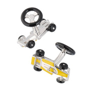 Pair of sterling silver three-dimensional Formula 1 racing car cufflinks with bright yellow enamel body panels, black enamel tires, polished silver open cockpit chassis detail, and black enamel steering wheel toggle bar closure, Jan Leslie