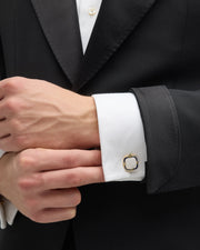 Gold mother-of-pearl and navy enamel cushion cufflinks styled on white French cuff with black tuxedo, Jan Leslie