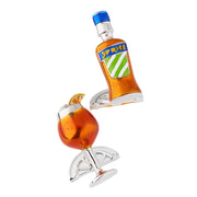Close-up of Aperol Spritz enamel cufflinks showing detailed bottle and orange cocktail glass with ice and citrus garnish.