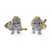 Sterling silver two-tone angel monkey cufflinks pair front view showing textured silver monkey body gold vermeil halo spread feathered wings and trumpet detail by Jan Leslie