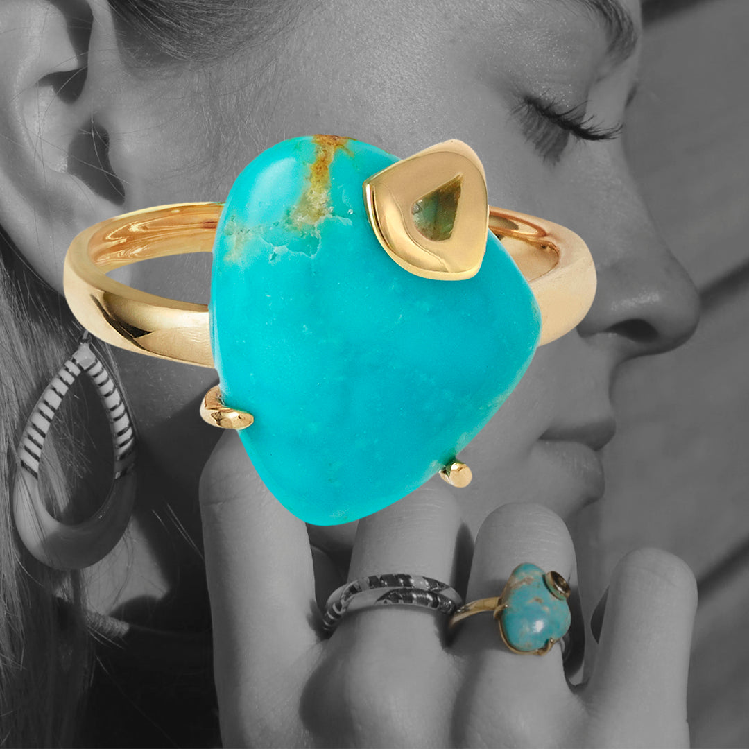 Koi Cascade Turquoise Minimalist Sterling Silver Ring with Gold Vermeil in color staged on a black and white picture of model wearing the Koi Cascade Turquoise Minimalist Sterling Silver Ring with Gold Vermeil background. Model in the picture is wearing Jan Leslie's 