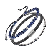 an Leslie men's blue and grey bracelet stack showing blue faceted sodalite rondelle bead bracelet with silver spacers grey braided leather bracelet with magnetic clasp and sterling silver foxtail chain bracelet layered together by Jan Leslie