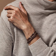 Dark brown braided leather bracelet with brushed silver cylindrical magnetic clasp