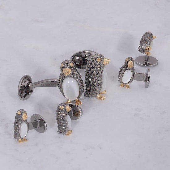 Video of a 180 degree view of Jan Leslie's Gemstone Penguin Sterling Silver Cufflinks and Tuxedo Studs on marble background. 