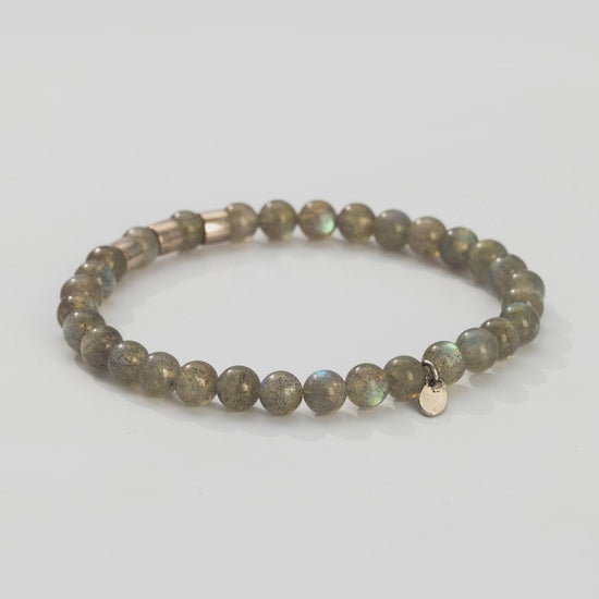 360 degree video of the Gemstone Beads and Sterling Silver Spacer Elastic Bracelet in labradorite. 