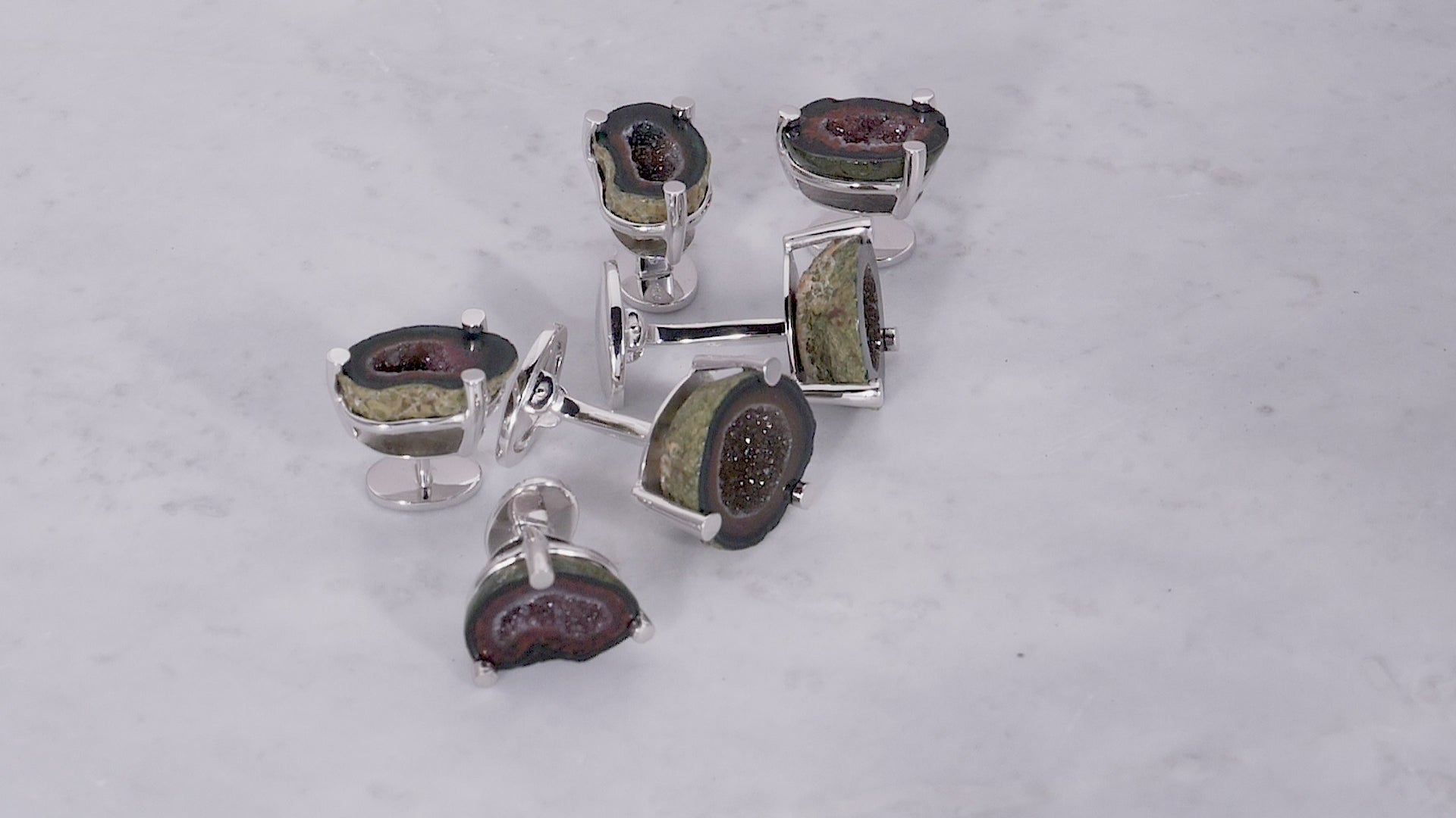 180 degree video of the Druzy Crystallized Gemstone Sterling Silver Cufflinks and Tuxedo Studs on marble background. 