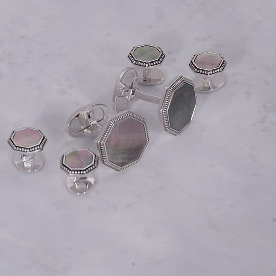 180 view of Jan Leslie's Octagon Gemstone with Antique Border Sterling Silver Cufflinks and Tuxedo Studs in grey mother of pearl. 