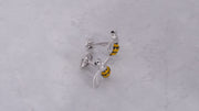 180 video of the Triumphant Bee Sterling Silver Cufflinks on a grey marbled background. 