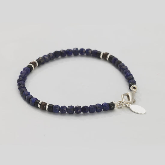 360 video of the Lapis Bead Bracelet with Wood and Sterling Silver Spacers and Lobster Closure. Video shows full bracelet and closeup of lapis beads, wood, and sterling silver spacers. 