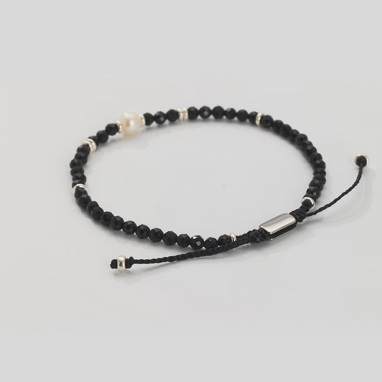 360 video of the Men's Black Onyx Beaded Bracelet with Freshwater Pearl Center. Video shows the full bracelet and close up of the freshwater pearl center and sterling silver spacers. 