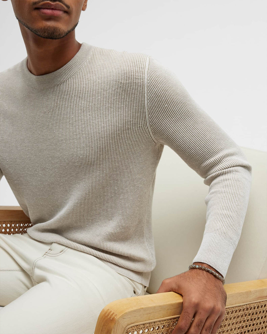 Male model wearing Jan Leslie's Gemstone Beads and Sterling Silver Spacer Elastic Bracelet in labradorite. 