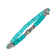 an Leslie turquoise rondelle bracelet with oxidized sterling silver disc spacers and turquoise cabochon end cap