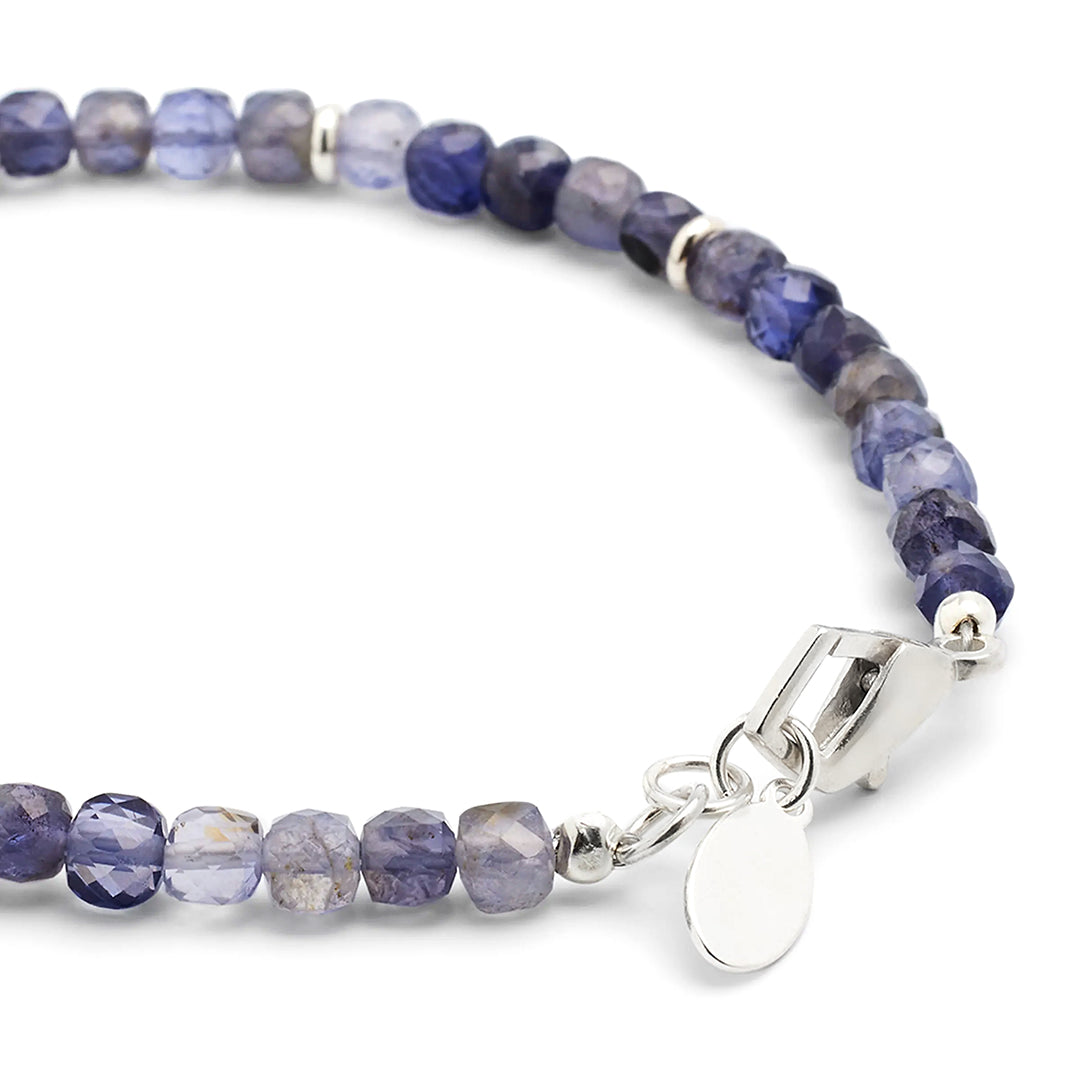 Close up of the sterling silver lobster claw closure on the Faceted Rutilated Quartz Gemstone Beaded Bracelet with Sterling Silver Skull. 