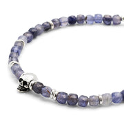 Close up of the faceted rutilated quartz, sterling silver spacers and skull on the Faceted Rutilated Quartz Gemstone Beaded Bracelet with Sterling Silver Skull. 