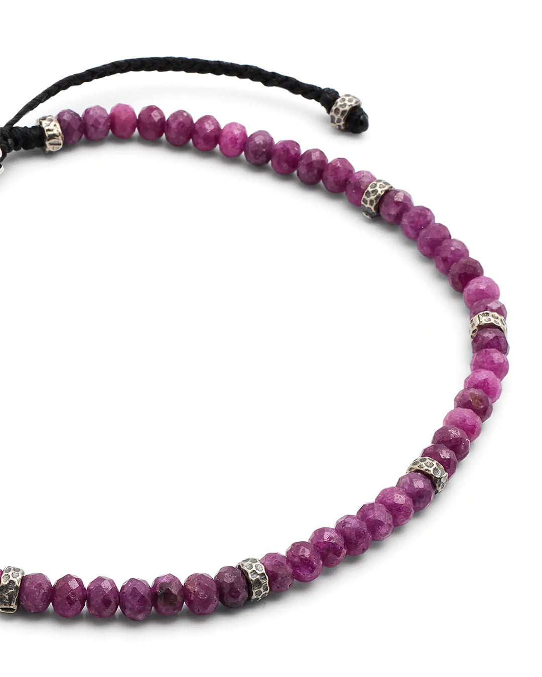 Close up of the faceted red ruby beads and sterling silver spacers on Jan Leslie's an Leslie Faceted Ruby Gemstone Bracelet with Black Pull Cord. 