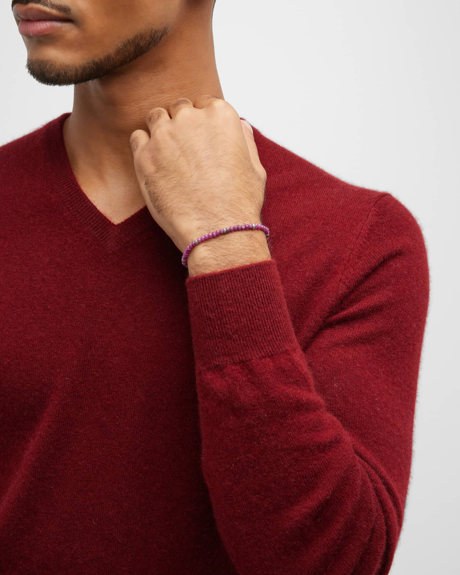 Male model wearing the Leslie Faceted Ruby Gemstone Bracelet with Black Pull Cord. 