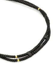 Close up of  black and sterling silver vermeil micro beads on the Double Strand Black Micro Bead Wax Pull Cord Sterling Silver Bracelet. 