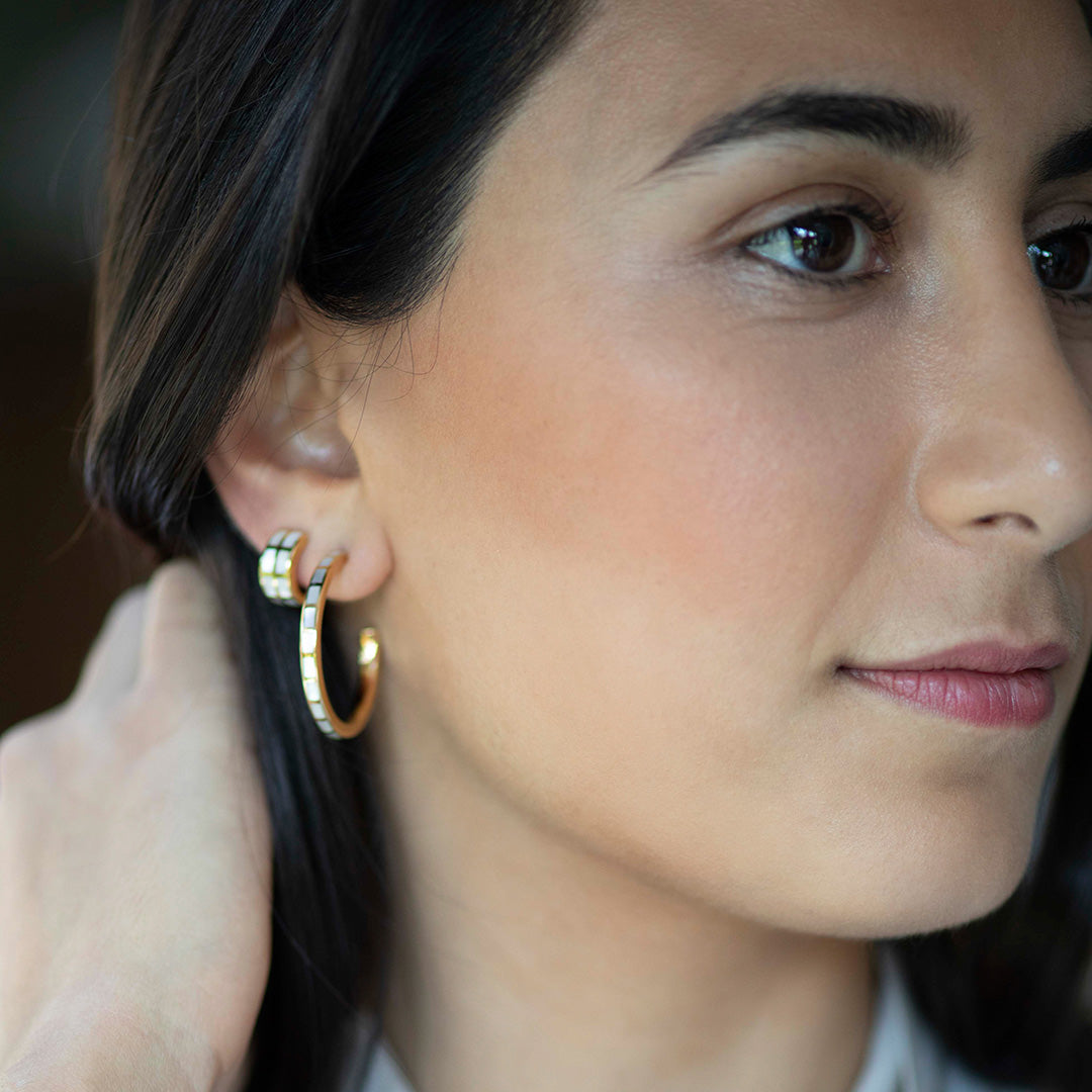 Model wearing Dash Hoop Gemstone 18K Gold Vermeil Sterling Silver Earrings in white mother of pearl on gold and  Dash Climber Gemstone 18K Gold  Vermeil  Sterling Silver Earrings.