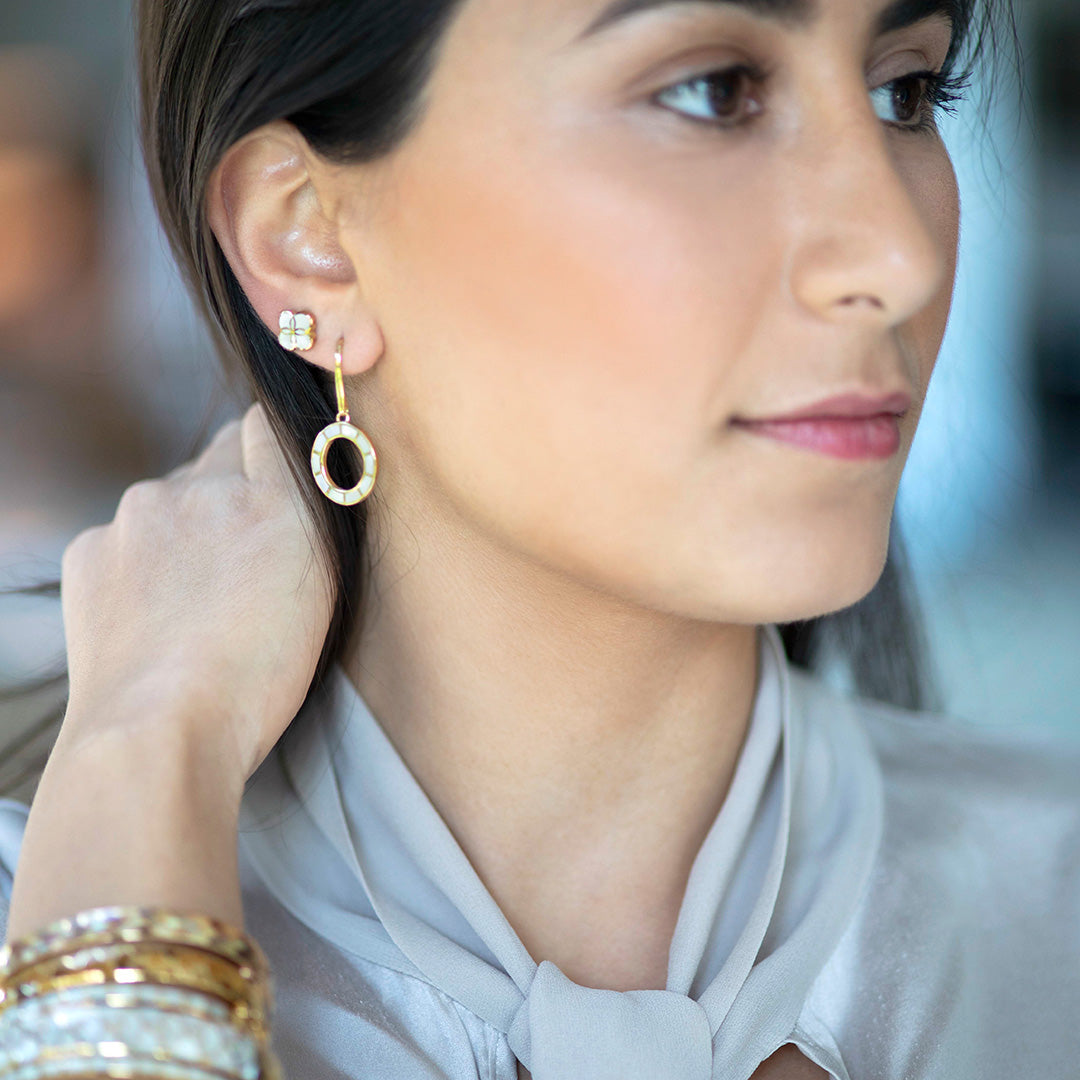 Smiling model wearing Dash Loop Dangle Gemstone 18K Gold Vermeil Sterling Silver Earrings and Koi Cascade Gemstone Inlay Petal  Stud  Sterling Silver Earrings. 