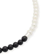 Close up of the matte black agate beads, sterling silver spacer, and freshwater pearls. 