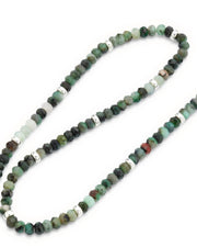 Close up of faceted emerald beads and sterling silver accents on the Emerald Beaded Necklace with Sterling Silver Accents and Toggle Closure. 