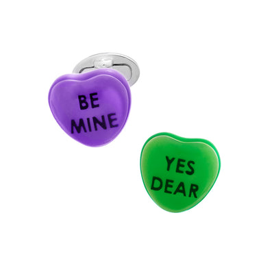 Purple and green candy heart sterling silver cufflinks. Purple cufflink has the phrase "Be Mine"  in black enamel. Green cufflink has the phrase "Yes Dear" in black enamel. 