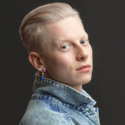 Side profile of male model wearing Bora Bora 18K Gold One of a Kind Gemstone Earrings. Jan Leslie Bespoke Earrings. 